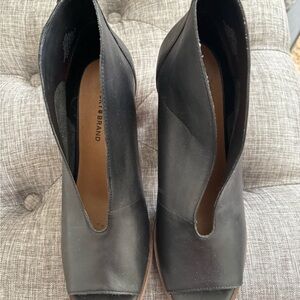 Black Heeled Boots with Unique Cut-Out Design and Pointed Toe